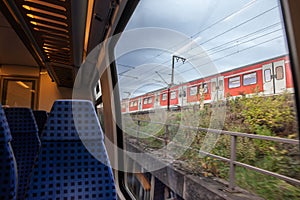 Selective blur on Empty seats in a modern german regional train in Cologne with a speed blur on S-Bahn suburban train in