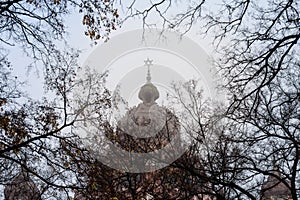 Selective blur on the Magen David, the jewish star, on the dome of Subotica synagoguewith a blurry fog in a cold autumn.