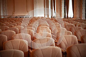 Selective blur on rows empty chairs in a conference room used for business meetings