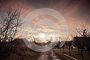 Selective blur on a Typical countryside road in the village of Alibunar, a serbian village of the Banat region of Vojvodina,