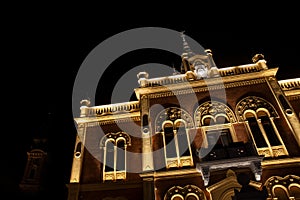 Selective blur on Vladicanski Dvor, the Bishop Episcopal palace with its typical Austro hungarian architecture, at night Novi Sad