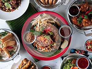selective choice food table Shell Crab noodle, Chicken Satay, Spring Roll, Curry Samosa, fish cake, Folks Drumlet, Pork Jar Salad