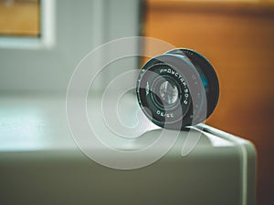 Selective closeup shot of black photo camera lens
