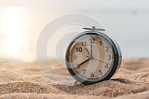 Selective focus of alarm clock with nature background