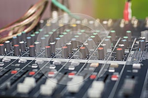 Selective focus on the audio mixer in the control room for meetings / workshops
