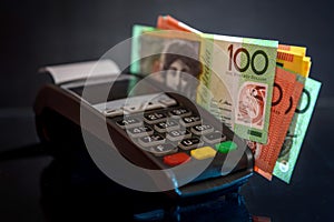 Selective focus on australian dollar banknotes with terminal