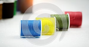 In selective focus of purple color thread on background,needlework,craft,sewing and tailoring concept