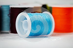 In selective focus of blue thread on background