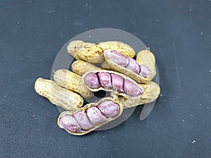 Selective focus of boiled peanuts on black background for sale
