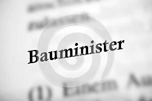 Selective focus from the book page of the word 'Bauminister'