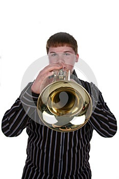 Selective focus of boy playing trumpet