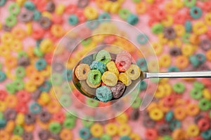 Focus of bright colorful breakfast cereal in spoon