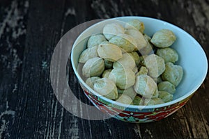 Selective focus of candlenut in the bowl