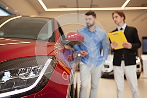 Car dealer selling new autos at the dealership