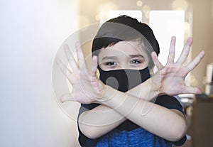 Selective focus Child showing clean hands,signalling stop and prevent coronavirus,Kid in self isolation showing hands after