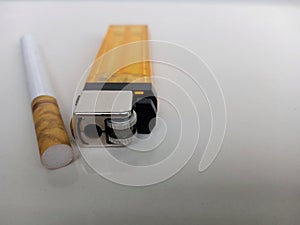 Selective Focus cigarette and gas lighter on white background