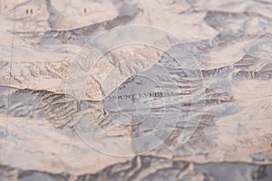 Selective focus close up of map detail Mt. Everest topographical map showing contour lines, elevation, shallow depth of