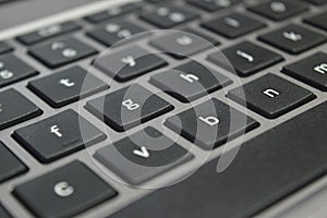 selective focus, Close-up shot of black computer keyboard with white numbers and letters