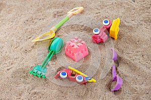 selective focus colorful children's toys on the sand Toy car and toy shovel concept in the technology age Children only play