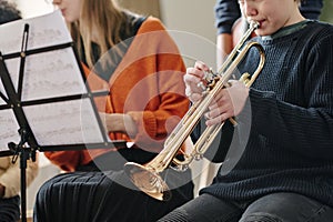 Kid Playing Trumpet In School Orchestra