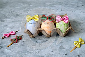 cute blue,orange  and green Easter eggs in funny bows