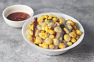 Selective focus of delicious Makhana chaat, made of roasted lotus seeds.