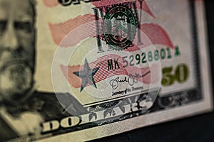 Selective focus on detail of 50 dollars banknote. Close up macro detail of money banknotes, dollars isolated. World money concept