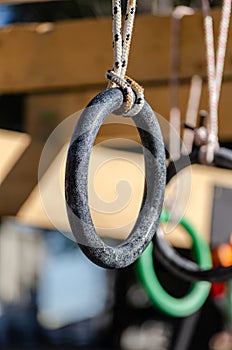 selective focus. detail of the rings of one of the obstacles of an obstacle race course, ocr