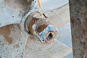 Selective focus of details old rusty ship propeller, waiting for