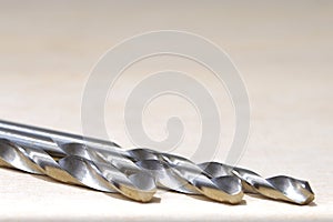 Selective focus of drill bits on the table with copy space area