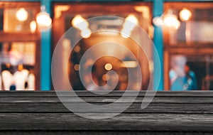 Selective Focus Empty wooden table in front of abstract blurred festive background with night market background bokeh for product