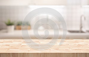 Selective focus.End grain wood counter,table top on blur kitchen counter in morning background