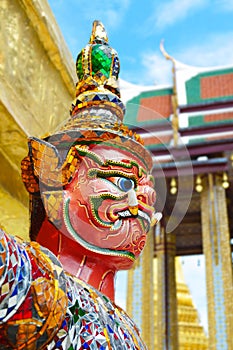 Selective focus face on giant statue at Wat Phra Kaew in Bangkok, Thailand photo