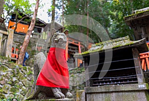 Selective focus of Fox statue at the Fushimi inari taisha shrine Kyoto, Japan