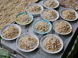 Selective focus of fresh red ant eggs for sale at a small local market in Thailand