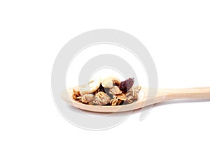 Selective focus granola cereal in wooden spoon