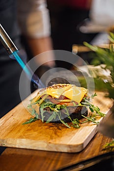 Process of cooking of tasty burger in burger bar