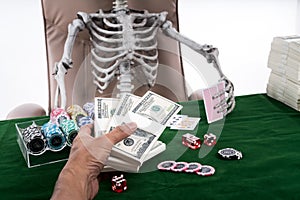 Selective focus at hand pay bets to Gambler skeleton on casino t