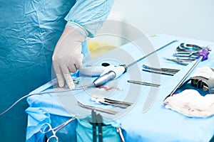 Selective focus on the hand of a surgeon wearing a sterile glove.