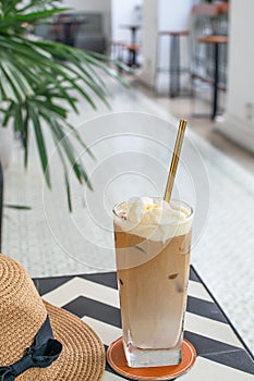 Selective focus of iced coffee with reusable metal drinking straw