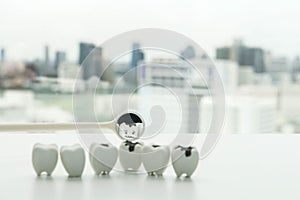 Selective focus icon of decay tooth from dental mirror for human oral health