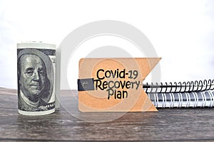 Selective focus image of bank note with Corona Virus-19 recovery plan wording isolated in white background. Business and economy