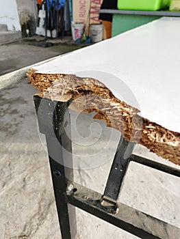 Broken corner of table.