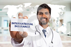 Selective focus image of doctor presenting international insurance