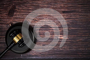 Selective focus image of gavel isolated over a wooden background. Law concept