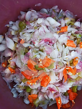 Selective Focus of Indonesian Traditional Raw Red Onion Sauce or Known As Sambal Bawang in A Container