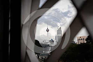Selective focus of Kuala Lumpur Tower framed by modern ornament design photo