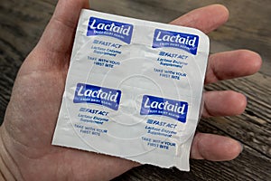 Seattle, WA USA - circa November 2022: Selective focus on Lactaid medicine in the palm of someone's hand