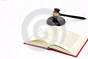 Selective focus, law book and judge gavel or hammer placed behind. Law, judiciary concept photo