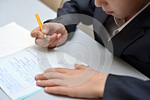 Selective focus of little boy learning how to write his name, Kid study at home, Children do homework at home, Concept for toddler photo